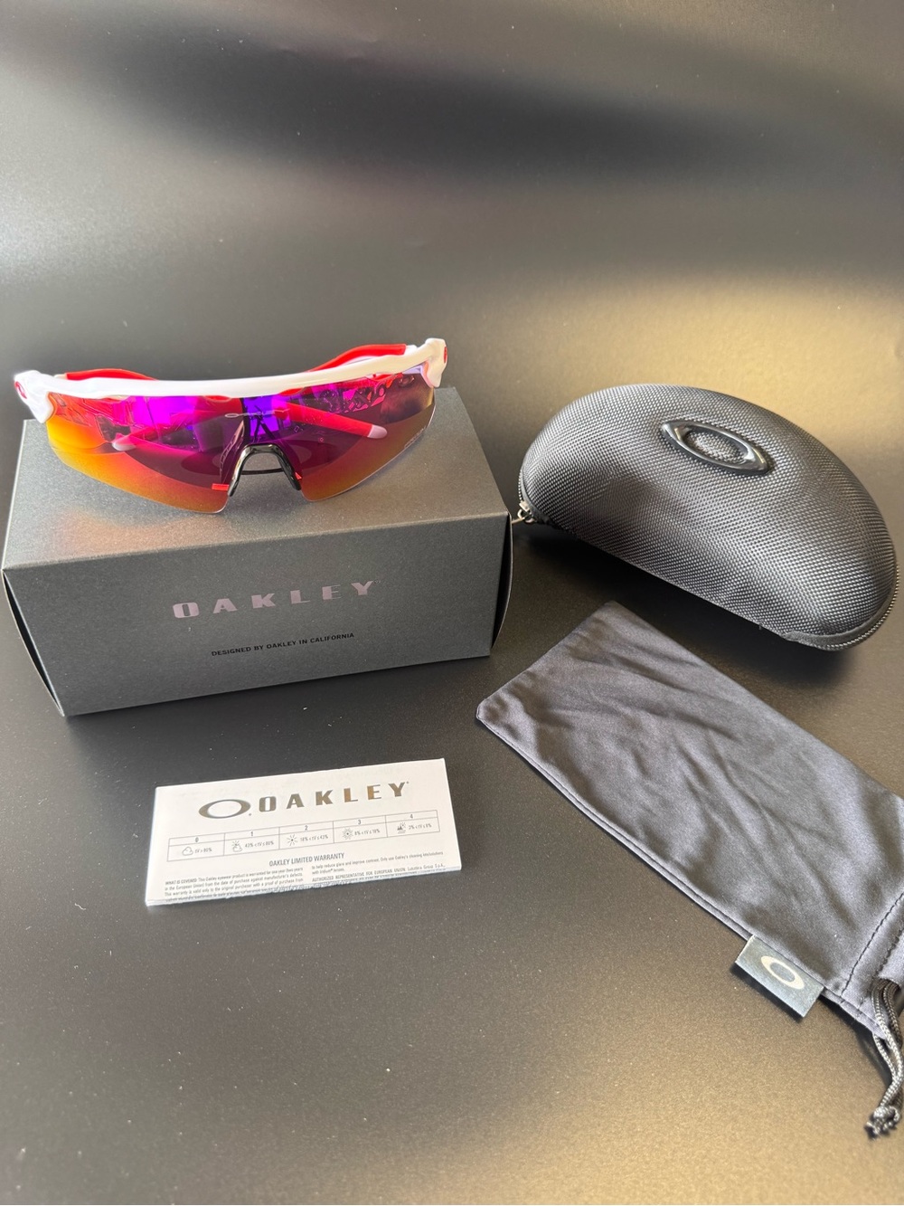 Oakley White Frame Sunglasses with Pink-Red Mirrored Lens